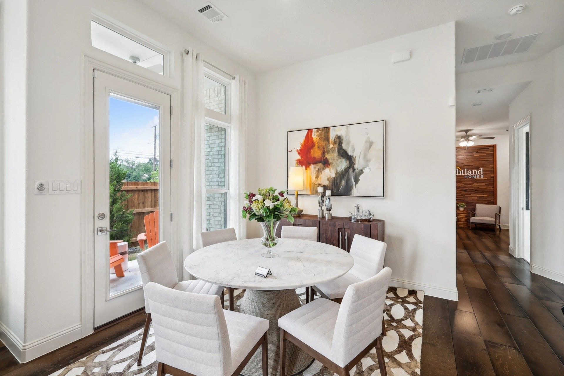Exquisite marble table and rich hardwood floors in this Heritage Park dining space epitomize luxury and style.