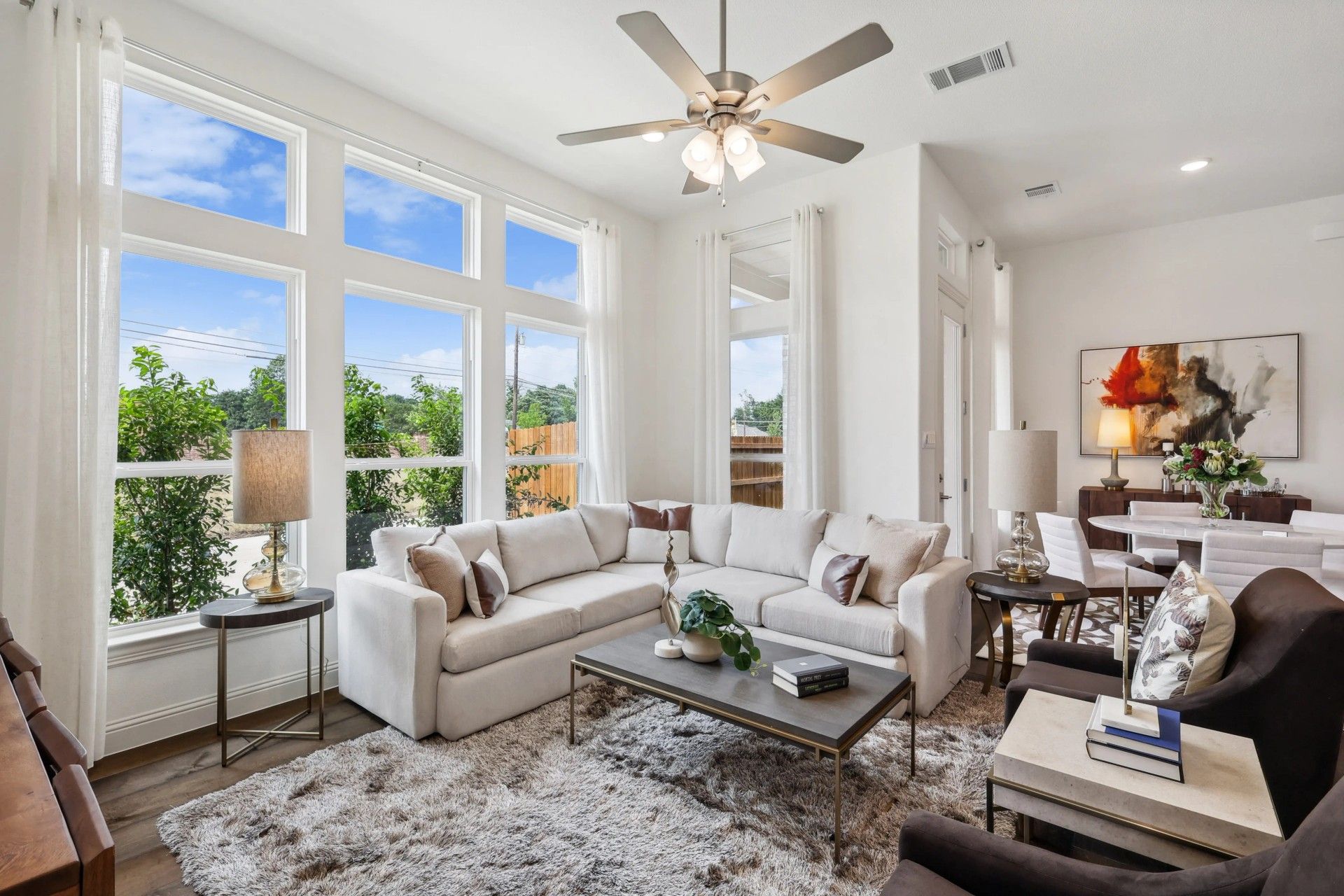 Exquisite design featuring expansive windows and plush furnishings in Heritage Park's premier residence.