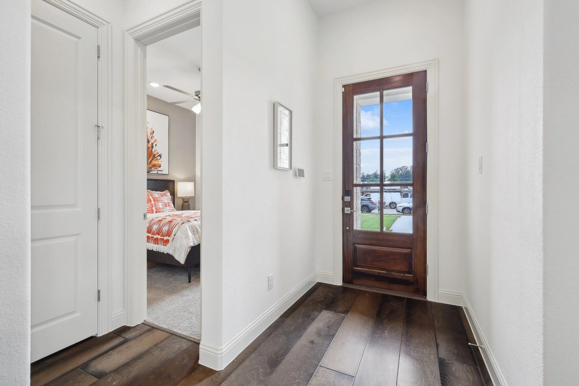 Exquisite wood flooring complements the glass-panel door in this Heritage Park residence.