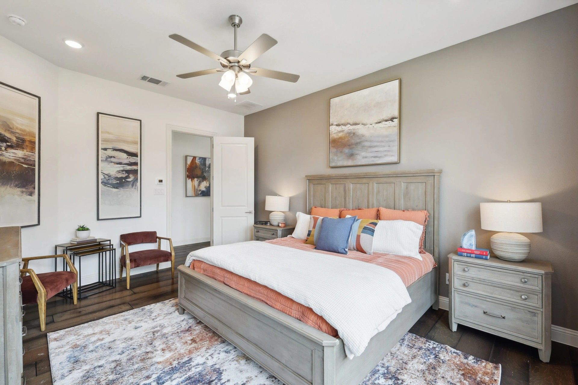Elegant bedroom with plush textiles, abstract art, and sophisticated lighting in Heritage Park.