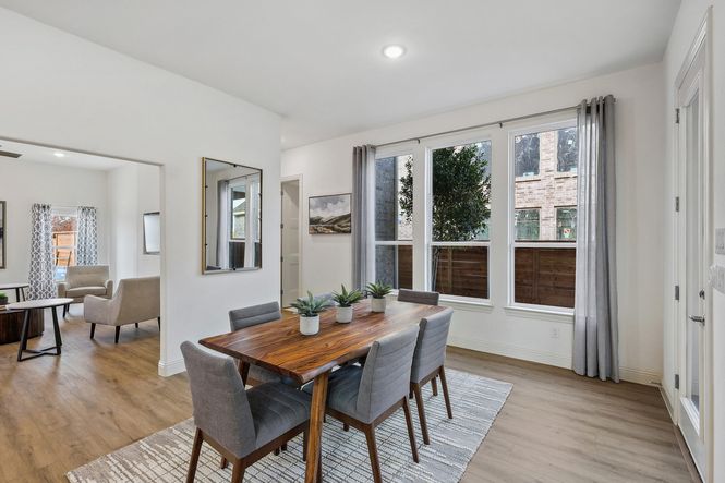 Experience luxury with floor-to-ceiling windows and exquisite hardwood flooring in Solterra, Texas.