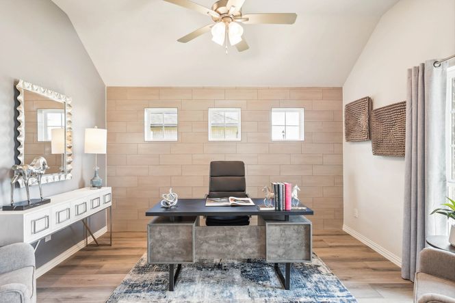 Stunning accent wall and sleek furniture enhance this elegant Pebblebrook office space.
