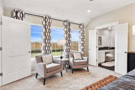 Elegant living space featuring plush carpet, geometric curtains, and seamless outdoor views in Simpson Crossing.