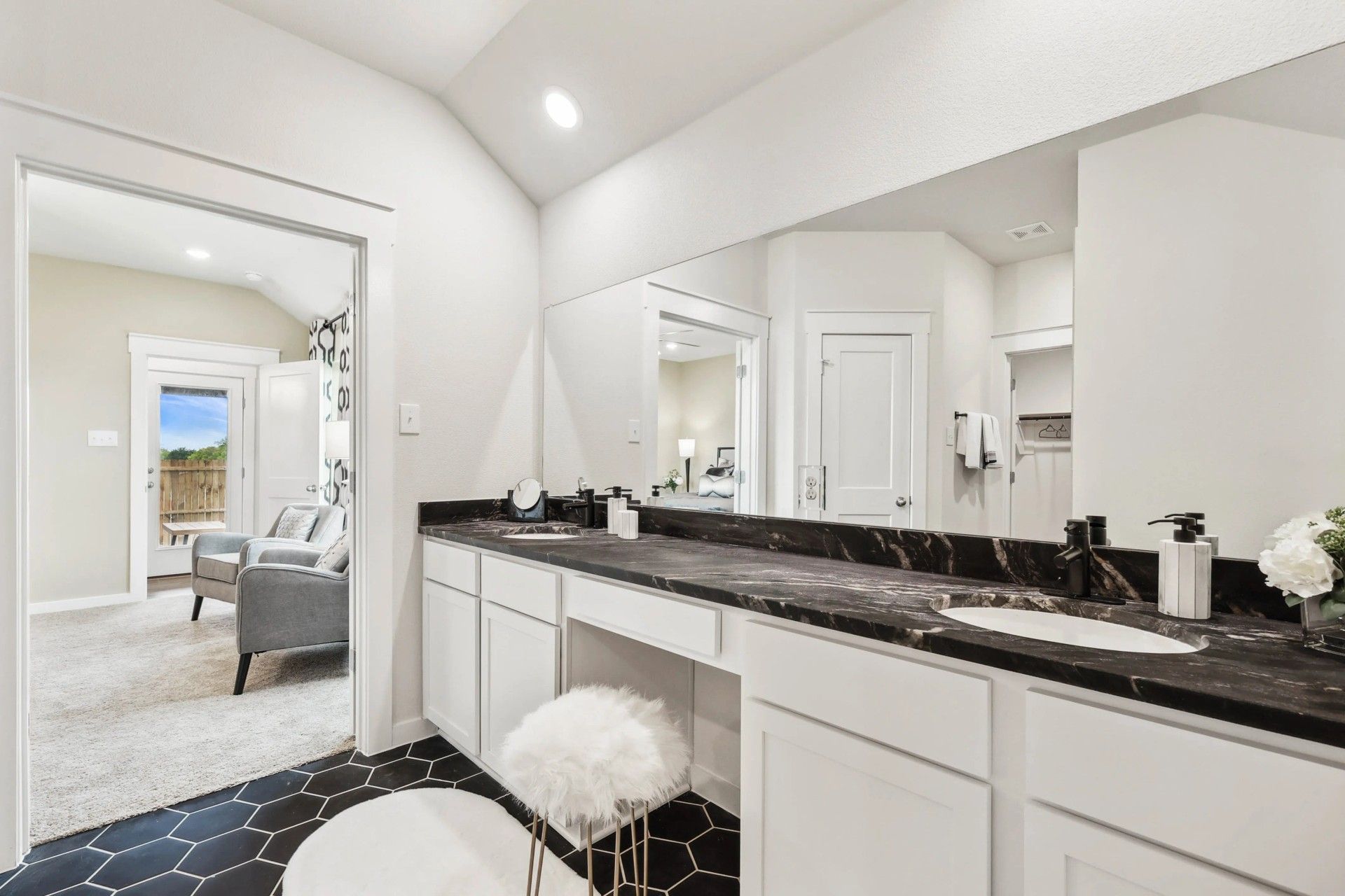 Indulge in elegance with a black marble countertop and sleek hexagonal tiles at Simpson Crossing.