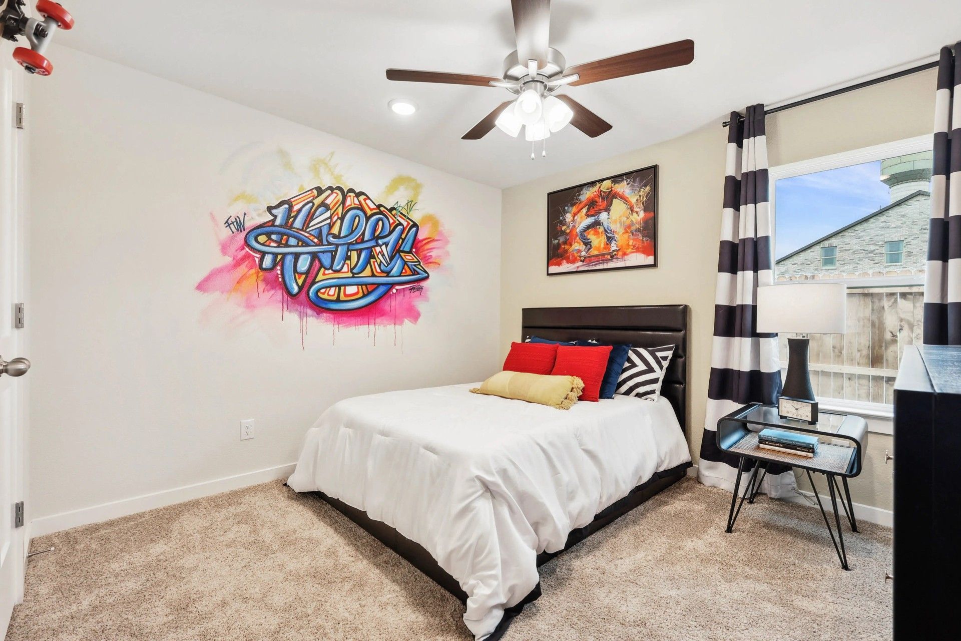 Chic design with bold graffiti art, plush carpet, and modern decor in Simpson Crossing.