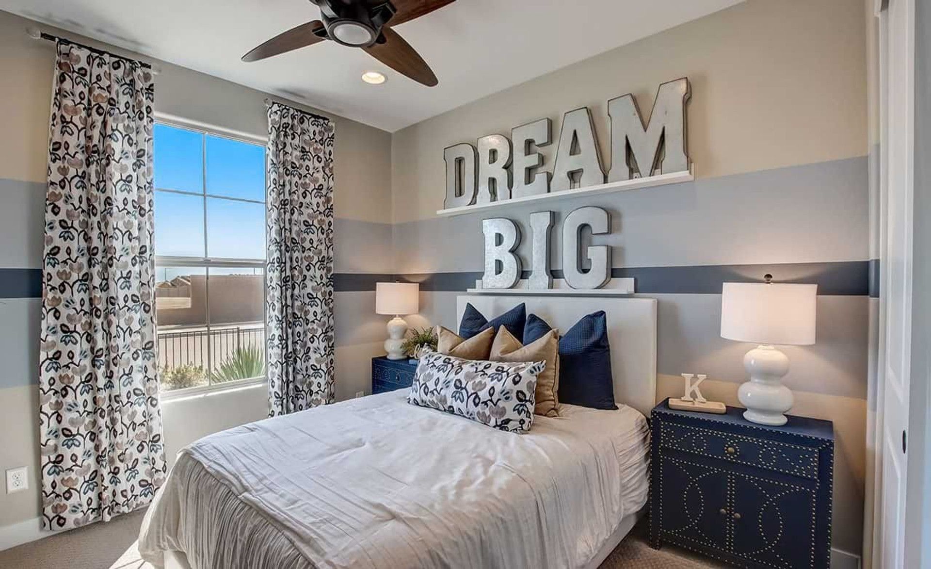 Luxurious bedroom with bespoke furnishings and statement wall art in Anderson Parc, Arizona.