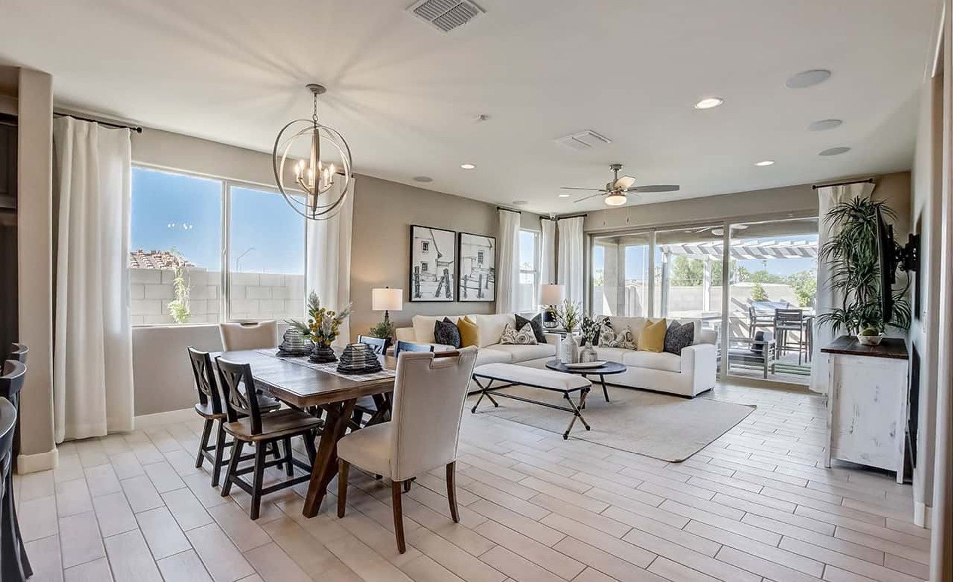 Experience luxury with open spaces, chic lighting, and serene patio access in Anderson Parc residence.