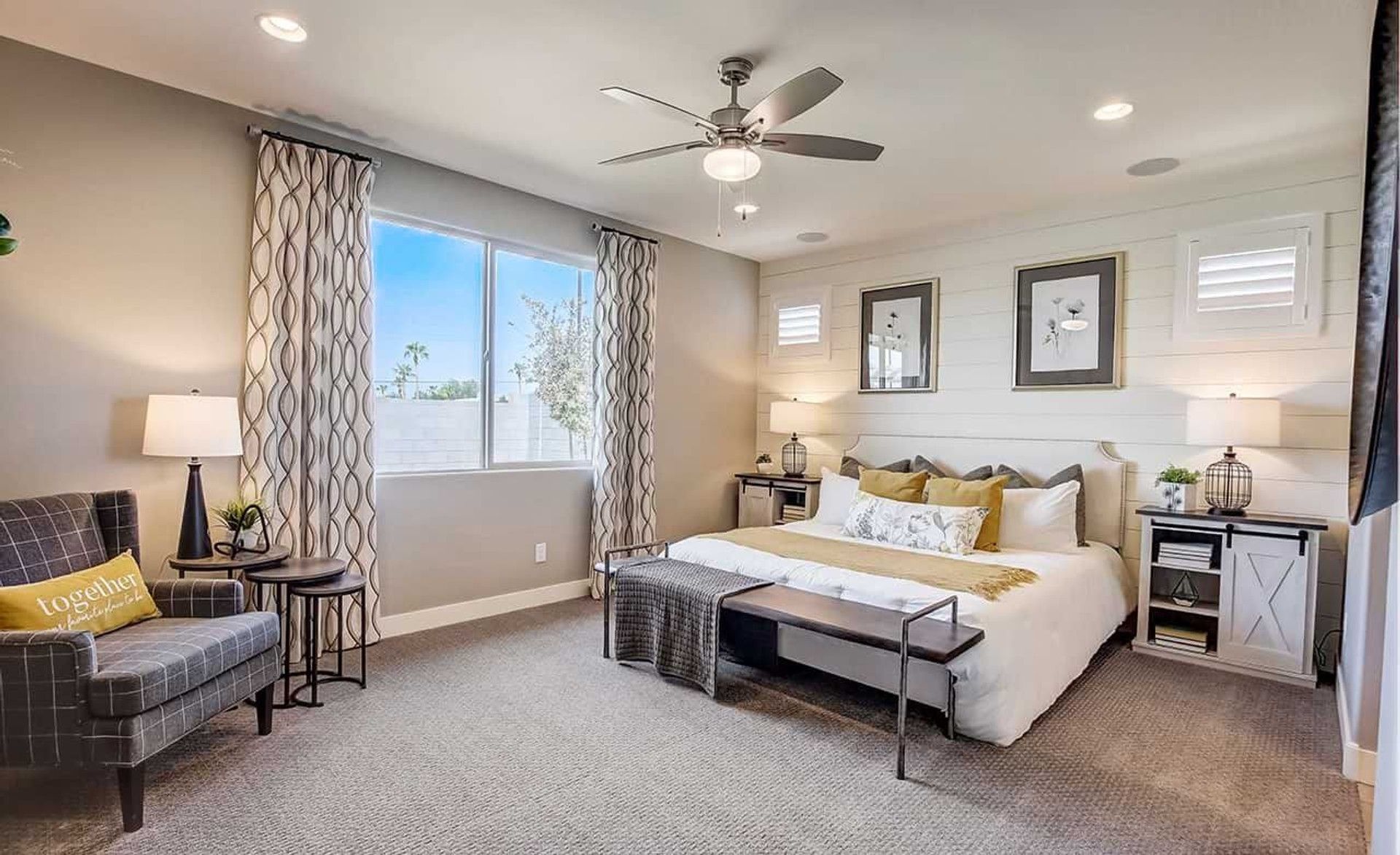 Experience luxury with a shiplap feature wall, plush carpeting, and designer accents in Anderson Parc.