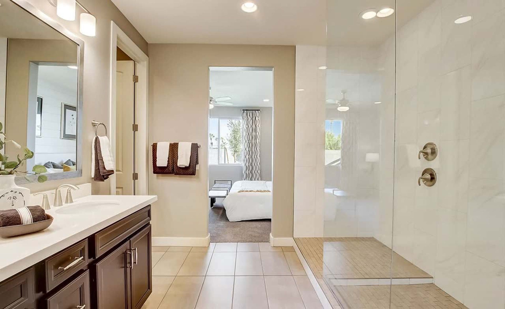 Discover opulent design with a sleek glass shower and dual vanity at Castillo, Anderson Parc.
