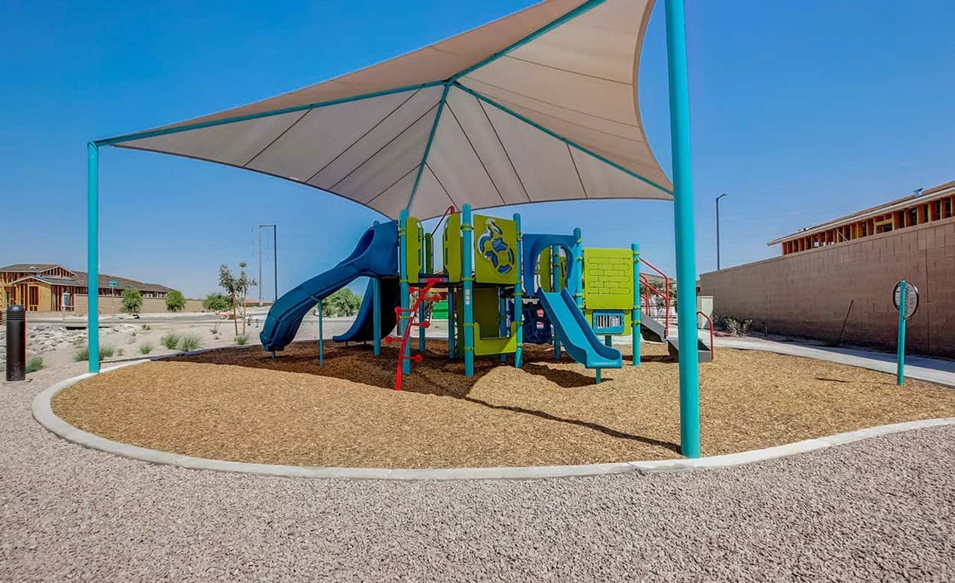 Elegant covered playground with durable materials at Castillo at Anderson Parc, blending function with modern design.