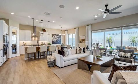 Elegant open-concept design features high-end finishes, spacious interiors, and breathtaking canyon views in Hacienda.