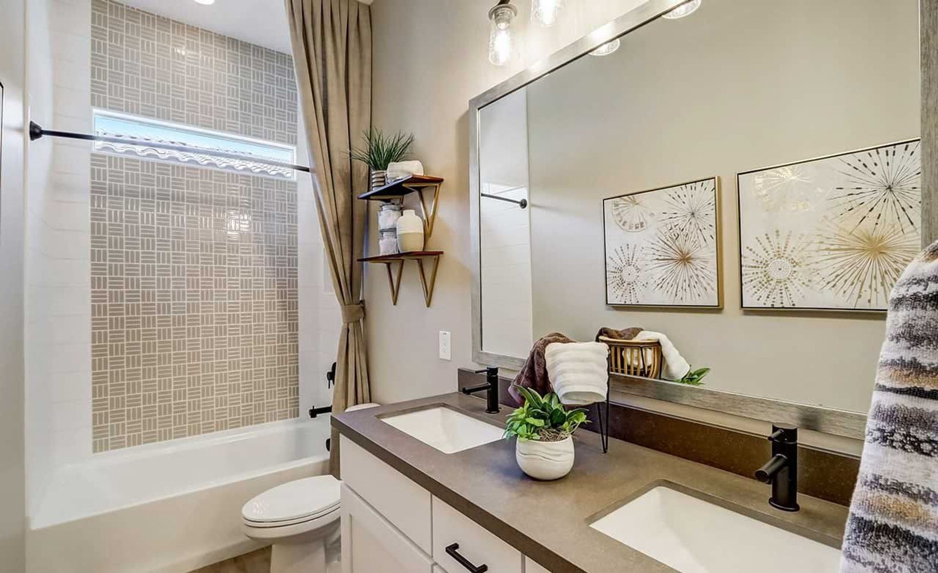 Experience elegant dual vanities and exquisite geometric tiles in Canyon Views' luxurious residences.