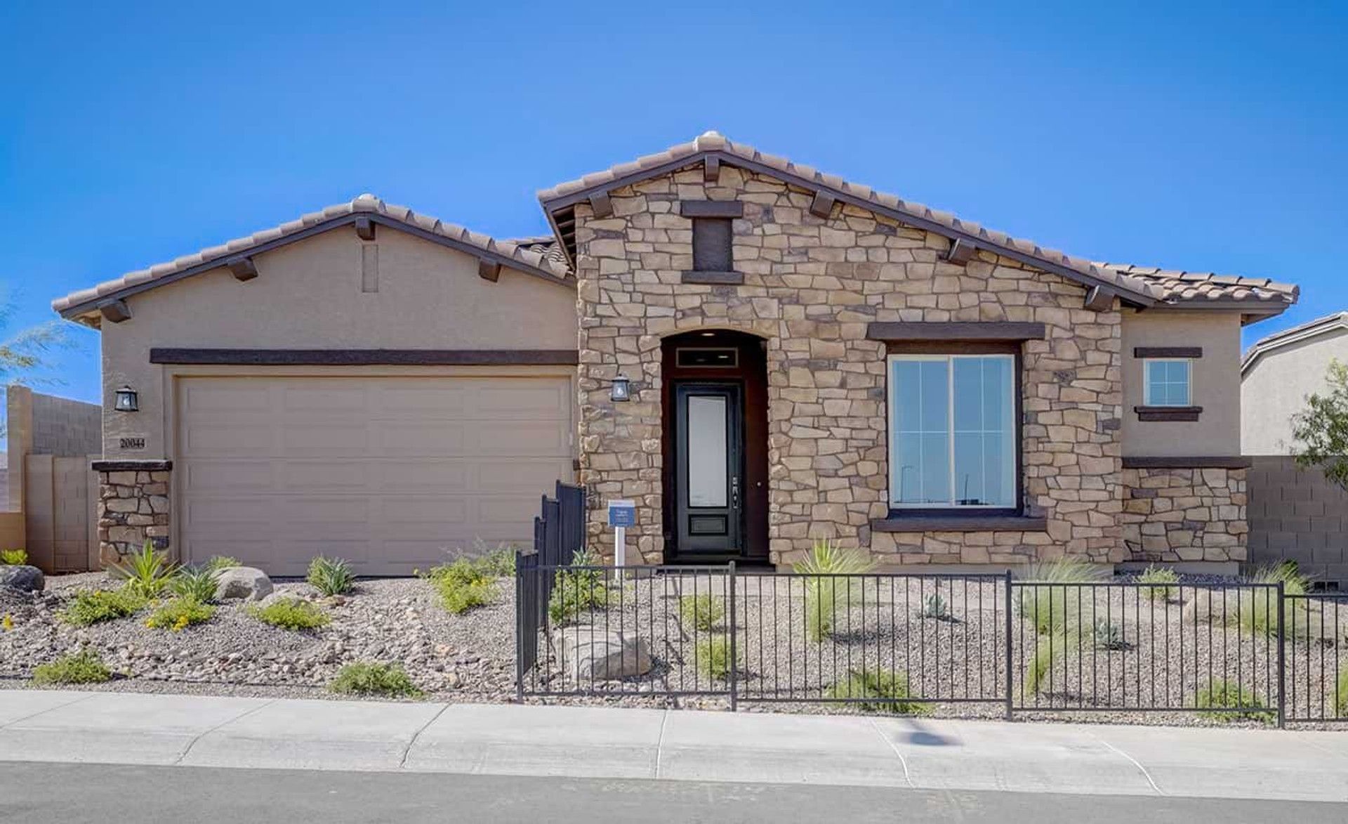 Experience refined living in Hacienda's Canyon Views, with a striking stone facade and desert-inspired gardens.