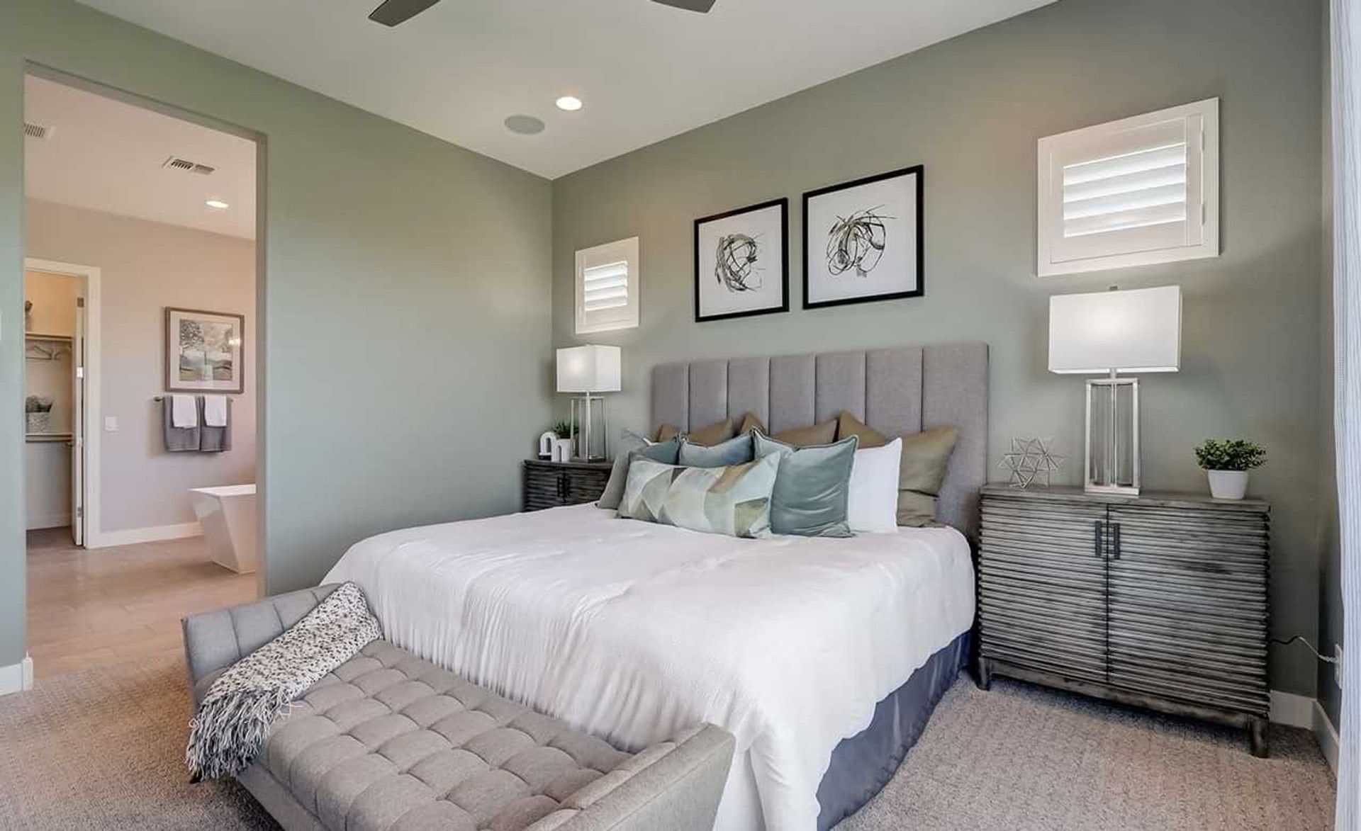 Experience serene luxury with plush bedding, stylish decor, and ambient lighting in Hacienda community.