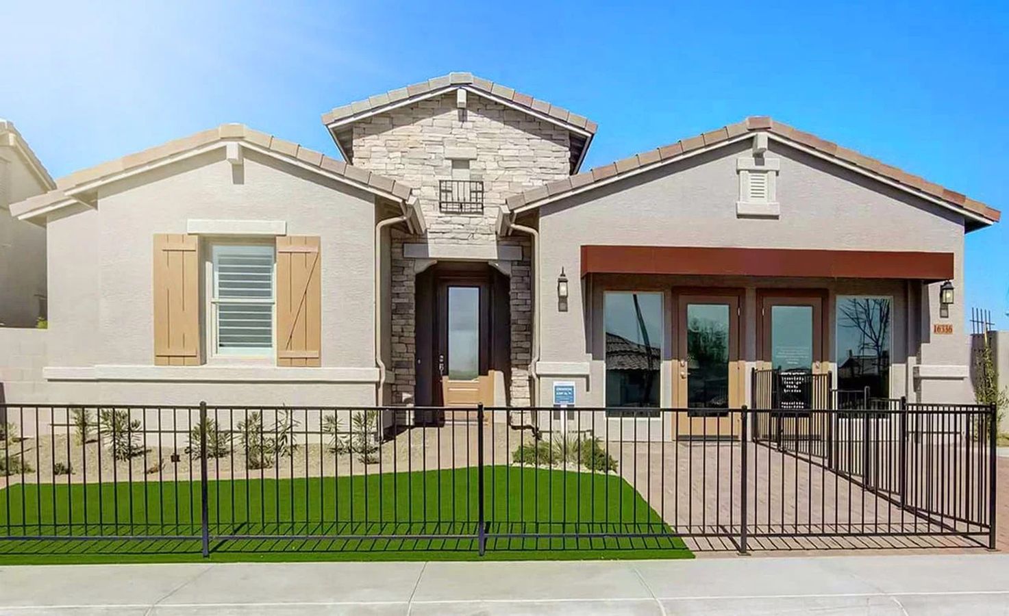 Expansive stone facade and elegant dual entry doors exude luxury in Mirada Crossing.