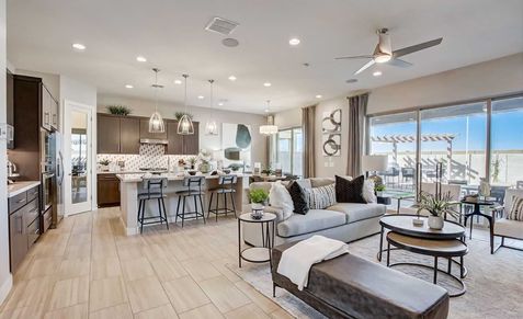 Experience luxury with a chic kitchen island, upscale lighting, and expansive windows in Mirada Crossing.