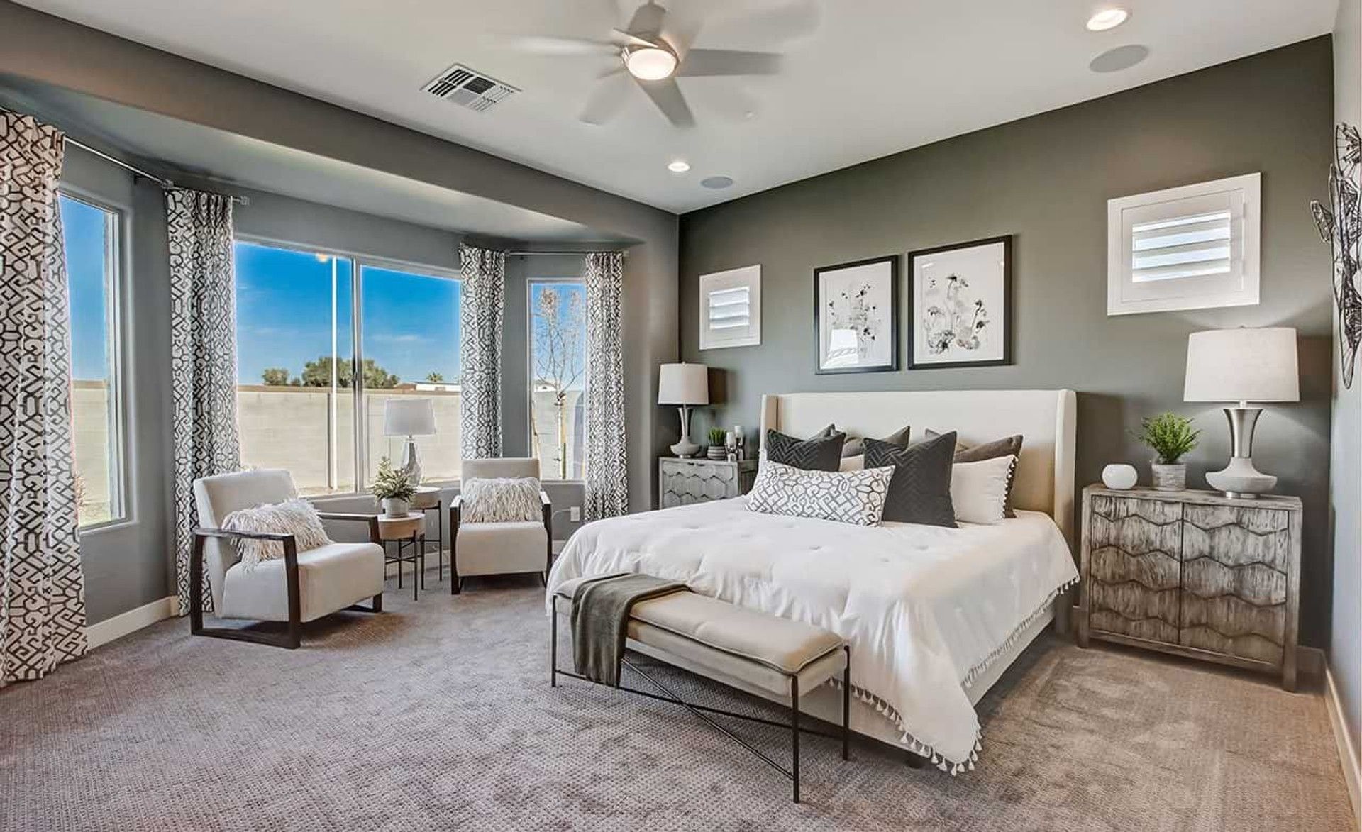 Luxurious bedroom with expansive windows, refined furnishings, and exquisite decor in Mirada Crossing.