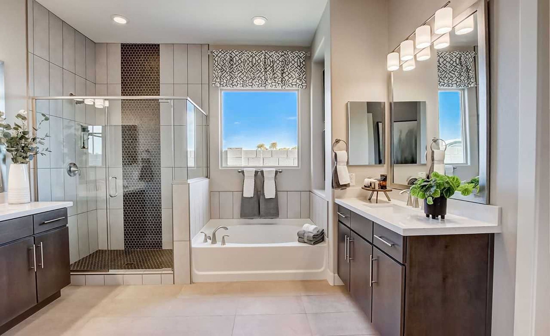 Experience refined elegance with a glass shower, stylish cabinets, and captivating views in Mirada Crossing.
