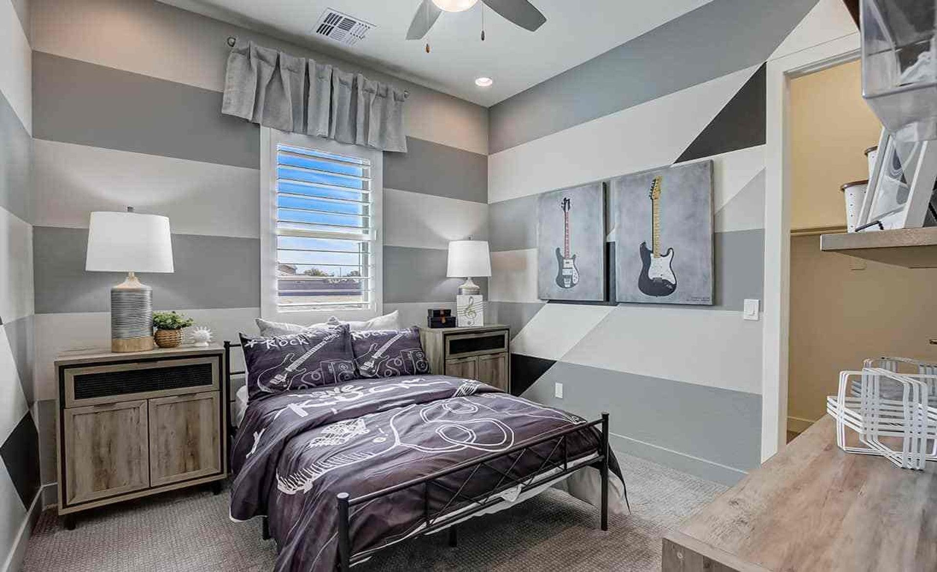 Experience sleek, modern design with bold stripes and chic guitar art in Mirada Crossing's refined interiors.