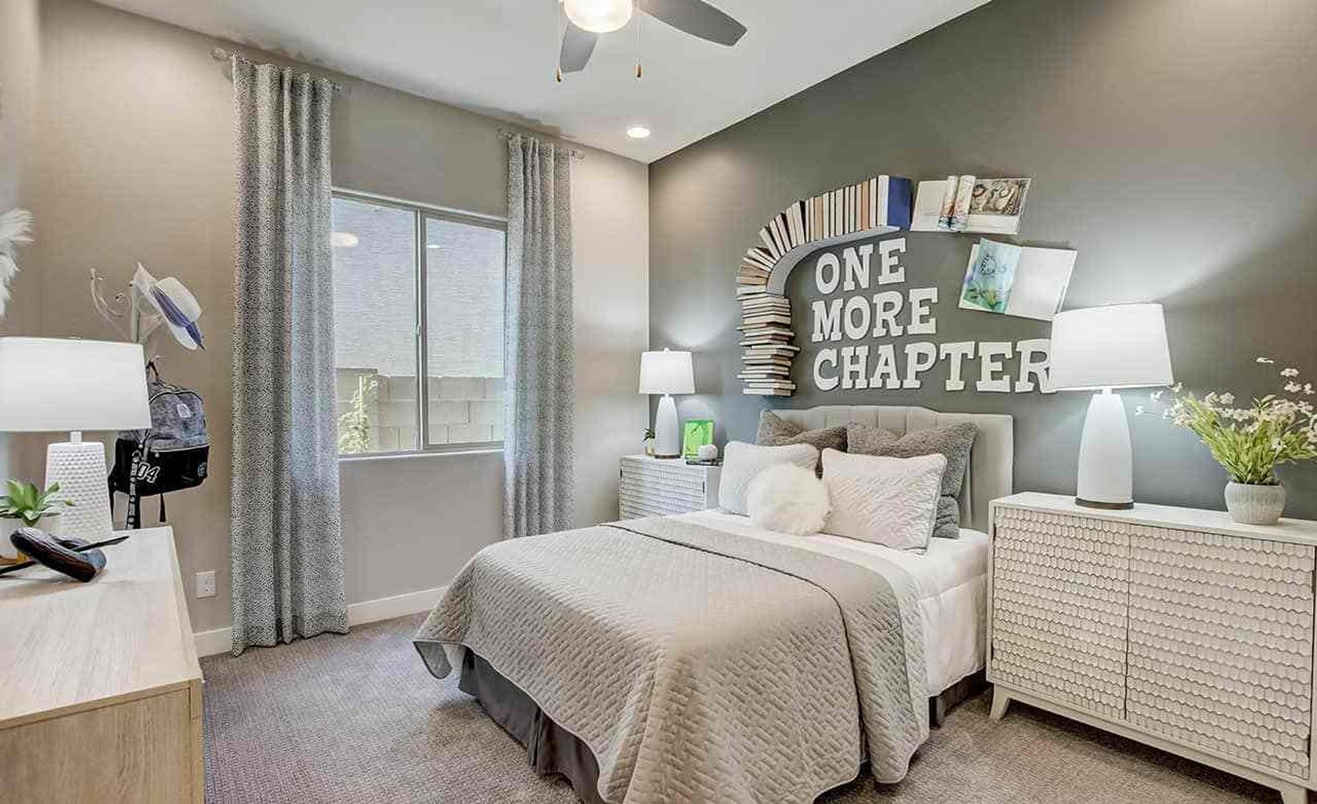 Luxurious Mirada Crossing bedroom with modern book-themed wall art and textured furniture.