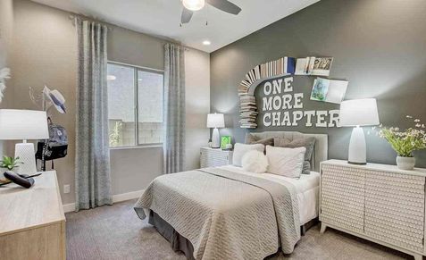 Luxurious Mirada Crossing bedroom with modern book-themed wall art and textured furniture.