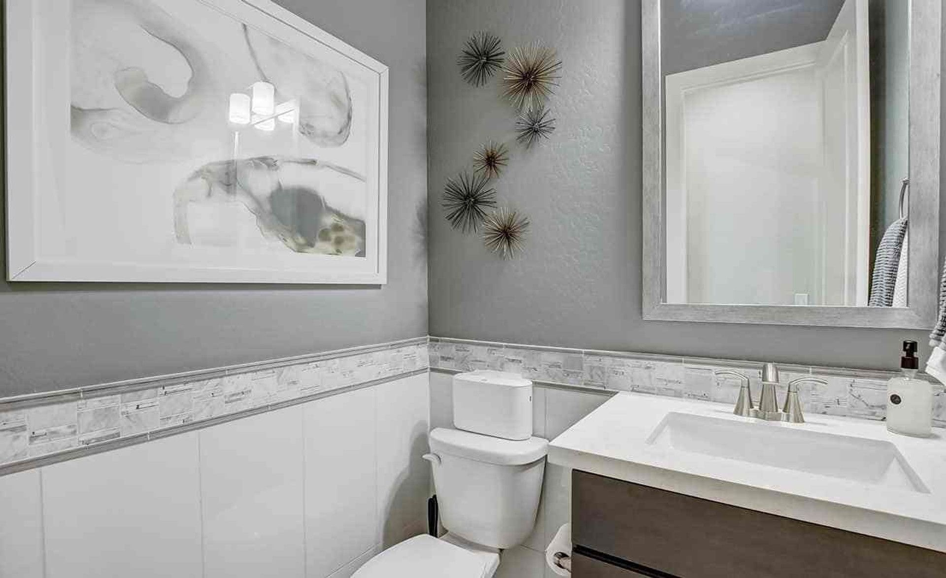 Experience sleek elegance with refined fixtures and designer tiles in Mirada Crossing's upscale bath spaces.
