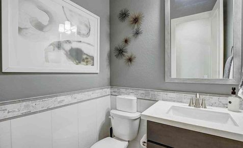 Experience sleek elegance with refined fixtures and designer tiles in Mirada Crossing's upscale bath spaces.