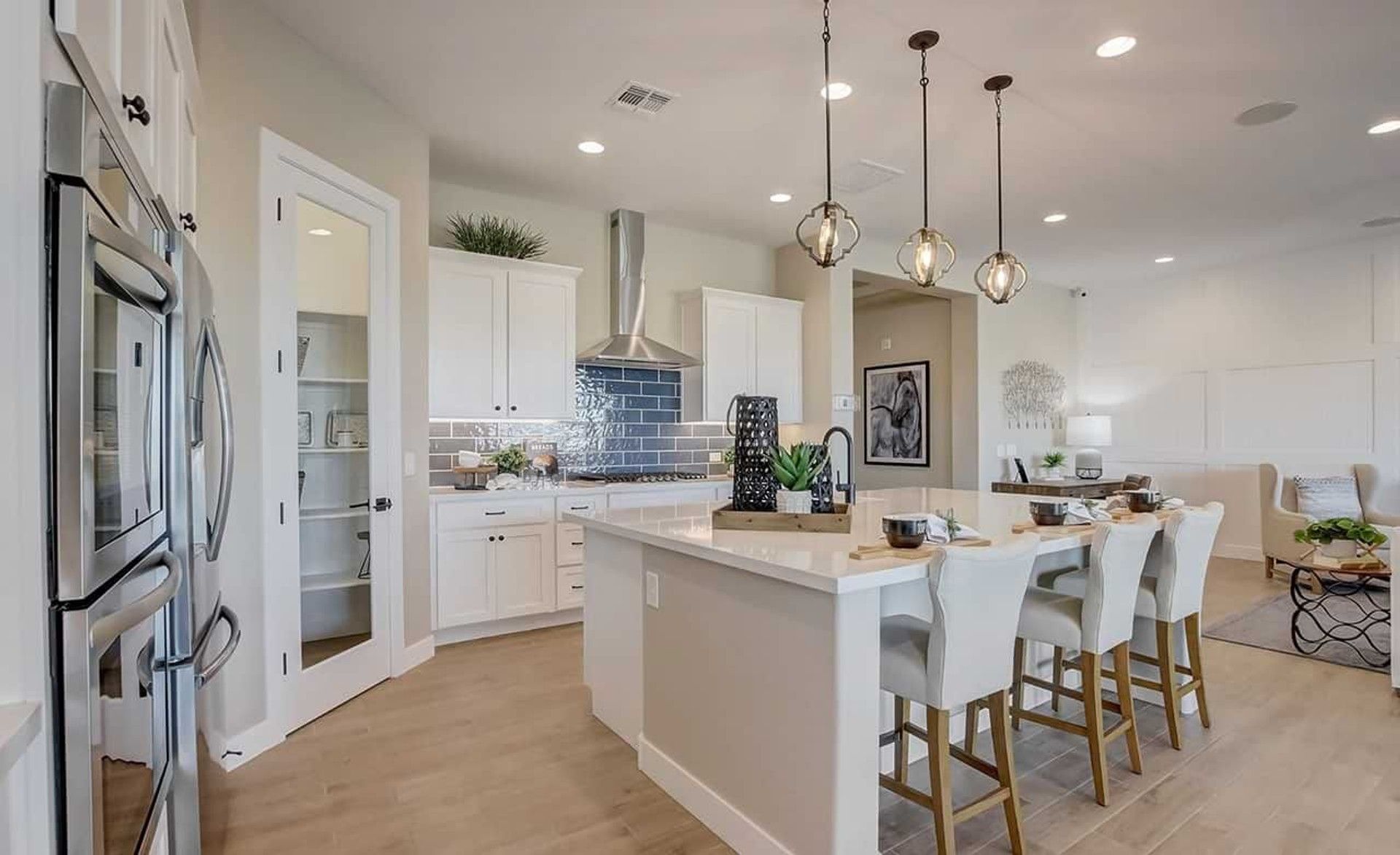 Exquisite Mirada Crossing kitchen boasts sleek quartz countertops, chic pendant lighting, and premium cabinetry.