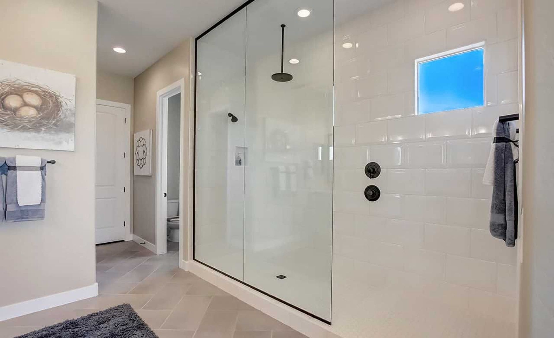 Experience luxury in a spacious glass shower with contemporary fixtures in Mirada Crossing.