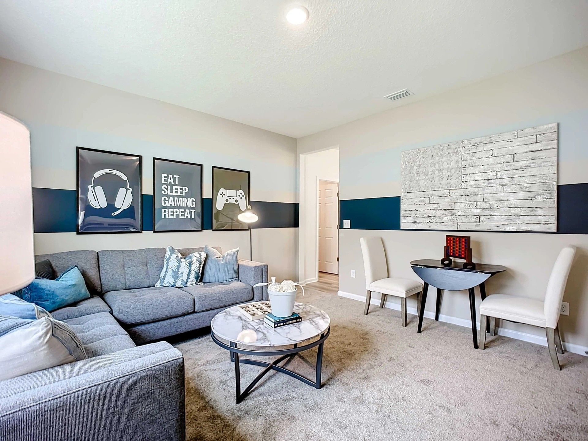 Elegant grey sectional and artful touches create a modern, upscale haven in Panther Creek.