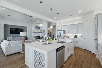 Exquisite white marble island and custom cabinetry in Rio Vista, Kelly Ranch. Timeless elegance and modern functionality.