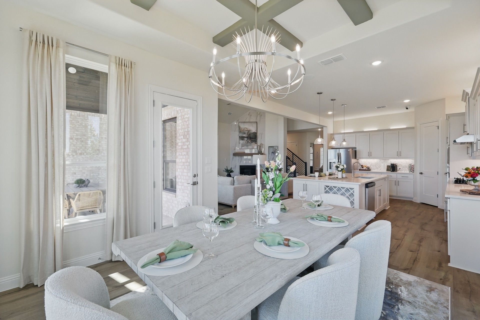 Experience refined living with a chic chandelier and gourmet kitchen, showcasing high-end finishes in Kelly Ranch.