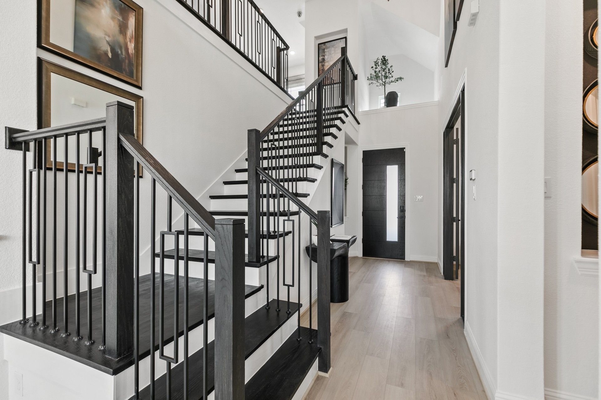 Experience refined elegance with sleek dark wood stairs and railings. Park at Eldridge.