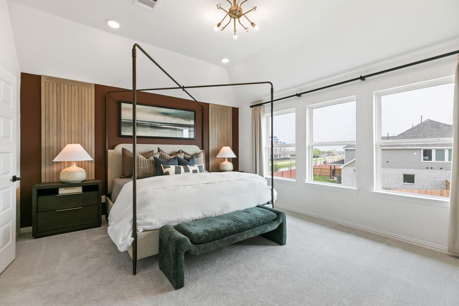 Luxurious bedroom with panoramic windows and bespoke wood accents, highlighting refined modern design in Eldridge.