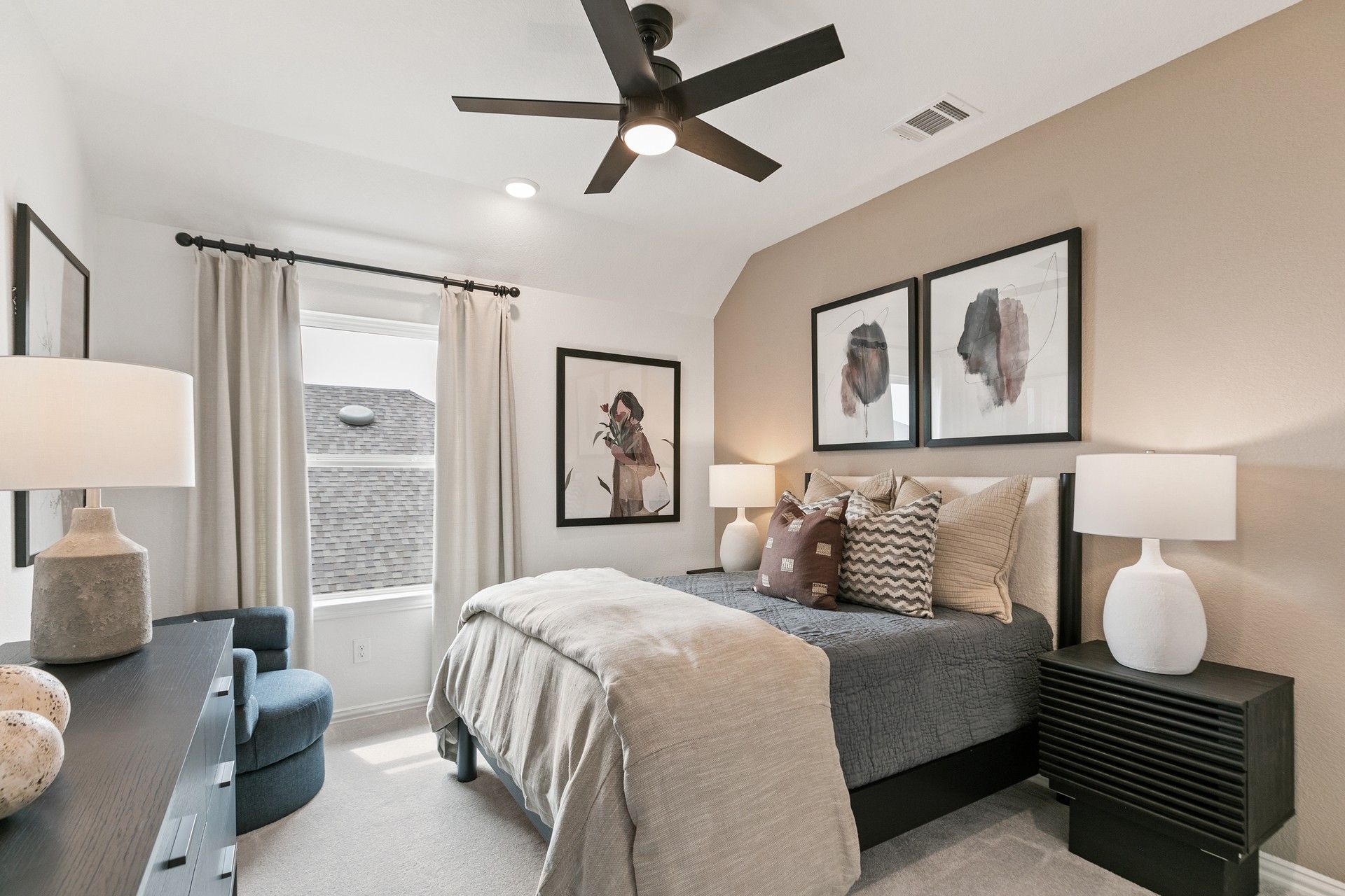 Luxurious bedroom with beige accent wall and plush textiles in Park at Eldridge's exclusive community.