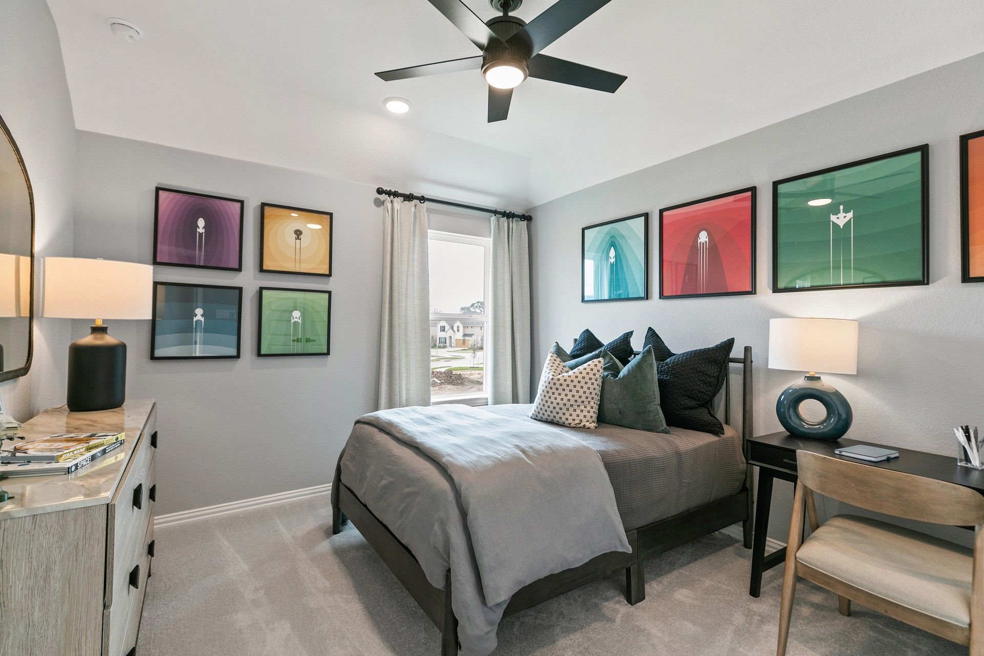Luxurious bedroom design with contemporary wall art and sleek fan at Park at Eldridge.