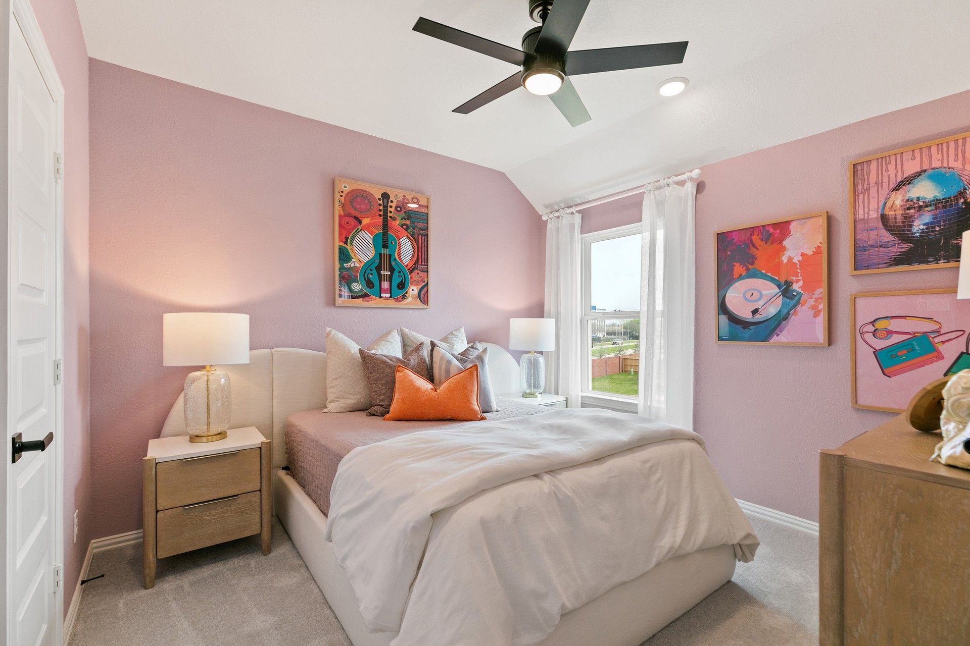 Discover understated elegance with pastel hues and unique artwork in this Park at Eldridge bedroom.