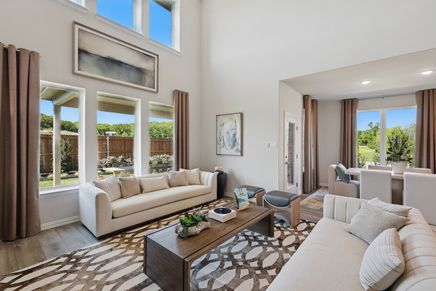 Experience elegance with high ceilings and abundant natural light in Green Oaks Preserve's refined interiors.