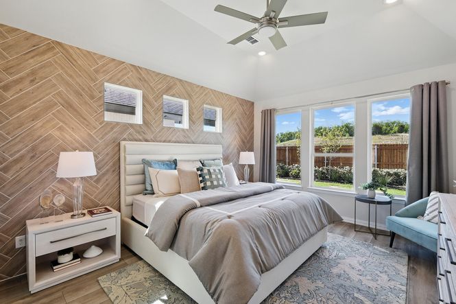 Revel in a chic herringbone accent wall and abundant natural light in Green Oaks Preserve.