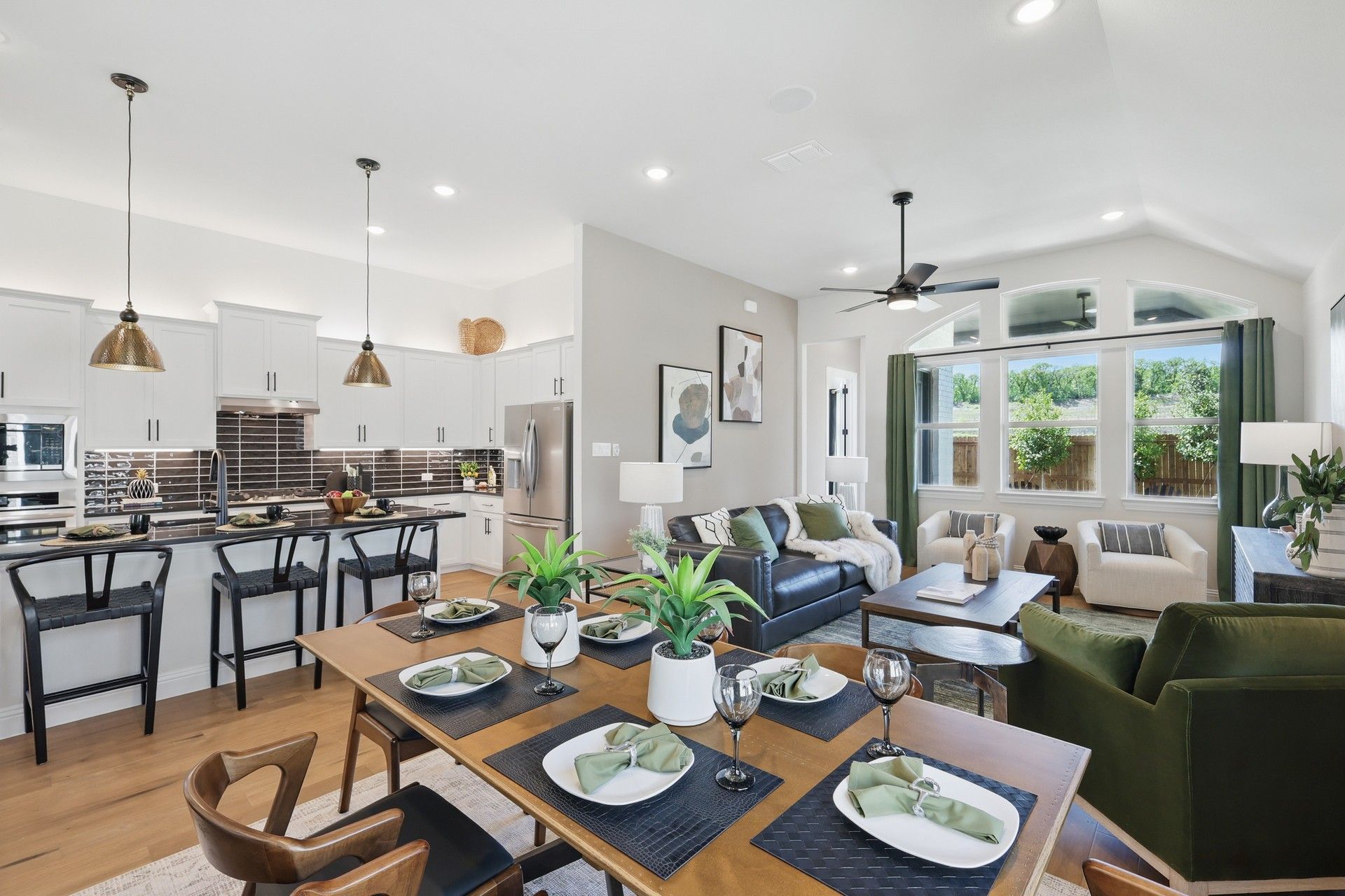 Experience sophistication with modern fixtures and a vaulted ceiling in Green Oaks Preserve.