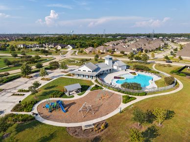 Elegant clubhouse with resort-style pool and playground in League City’s Coastal Point community.