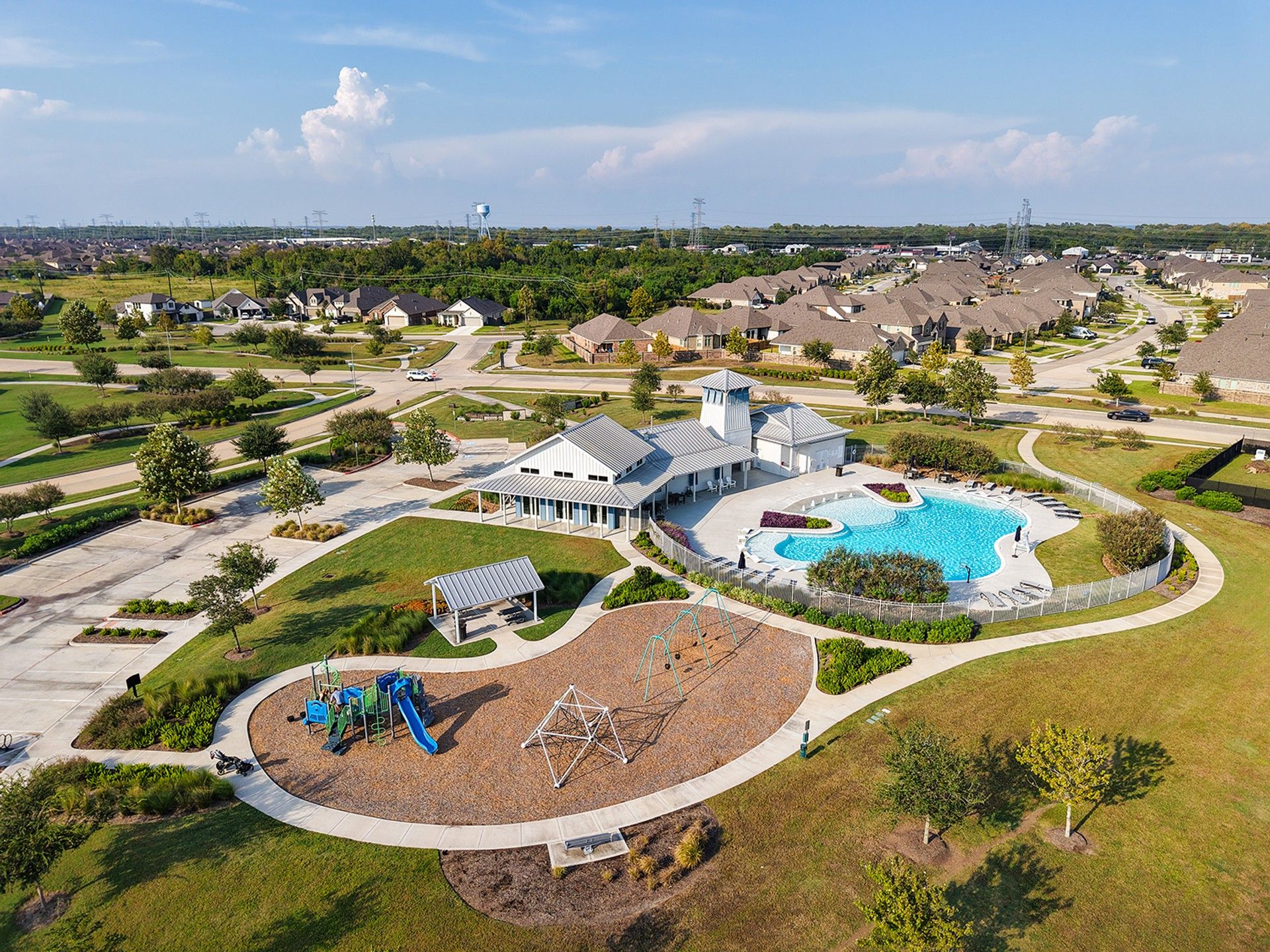 Elegant clubhouse with resort-style pool and playground in League City’s Coastal Point community.