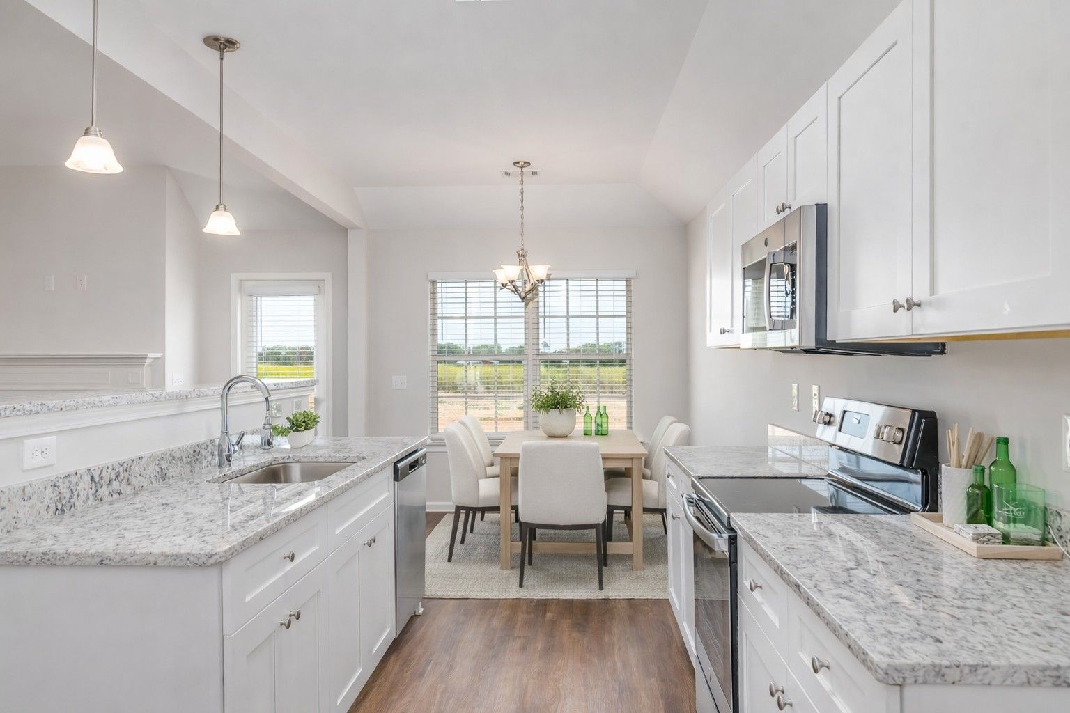 Staged Kitchen and Eat in Dining