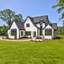 casa en Bluffs at Wesley Chapel por Grand Living Homes
