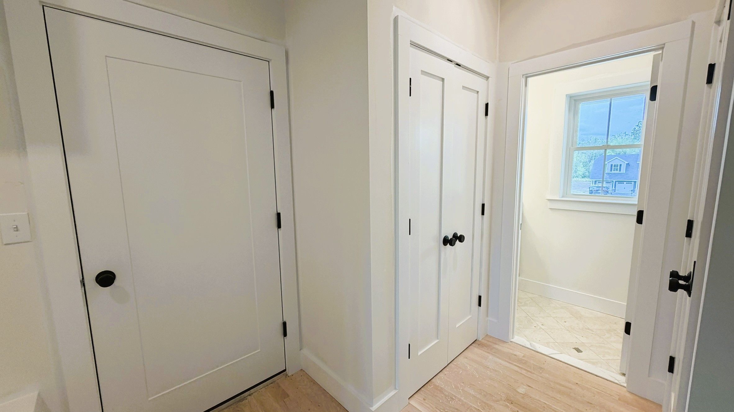 Construction Progress Photo of Hall Leading to Half Bath