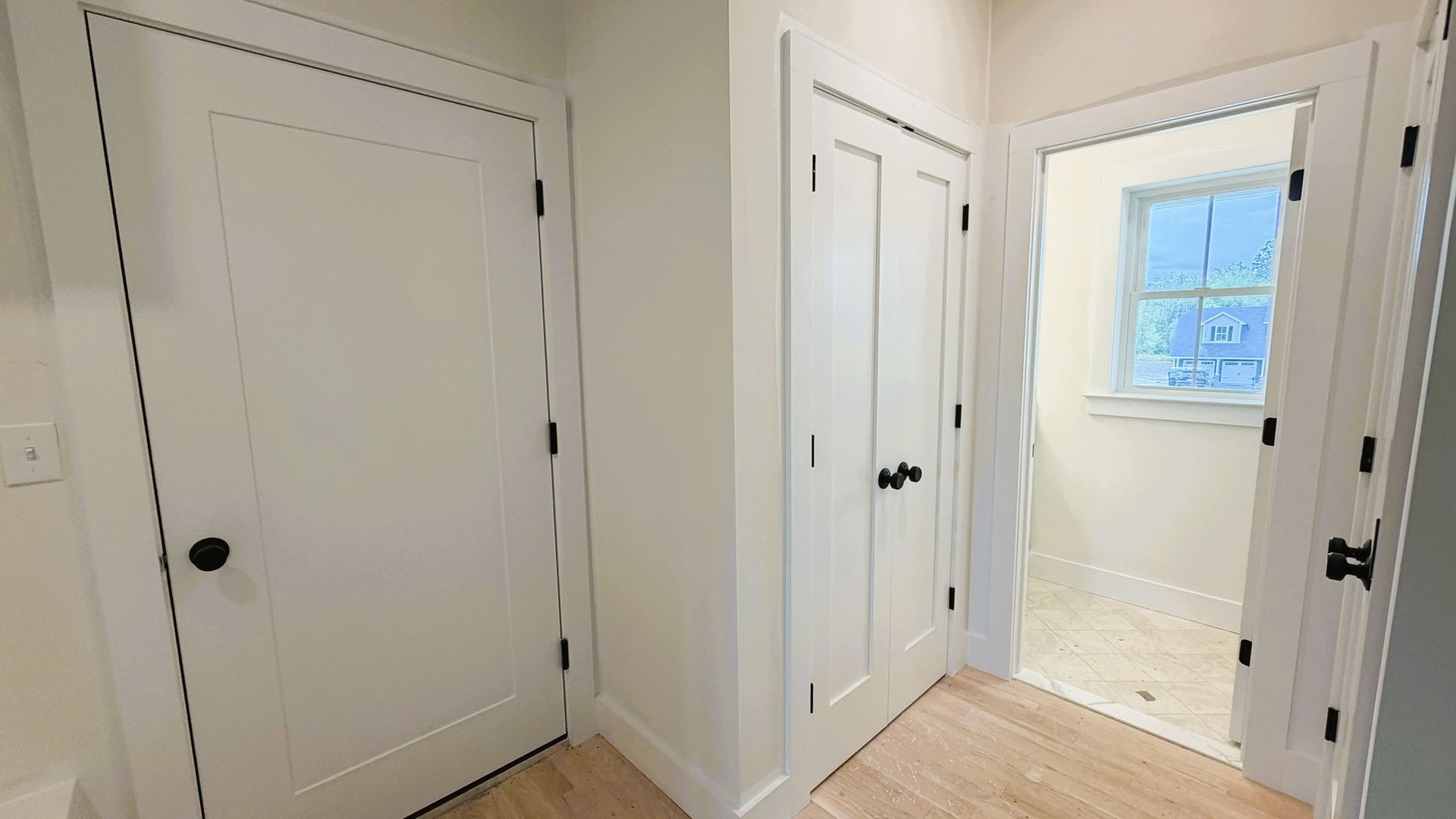 Construction Progress Photo of Hall Leading to Half Bath