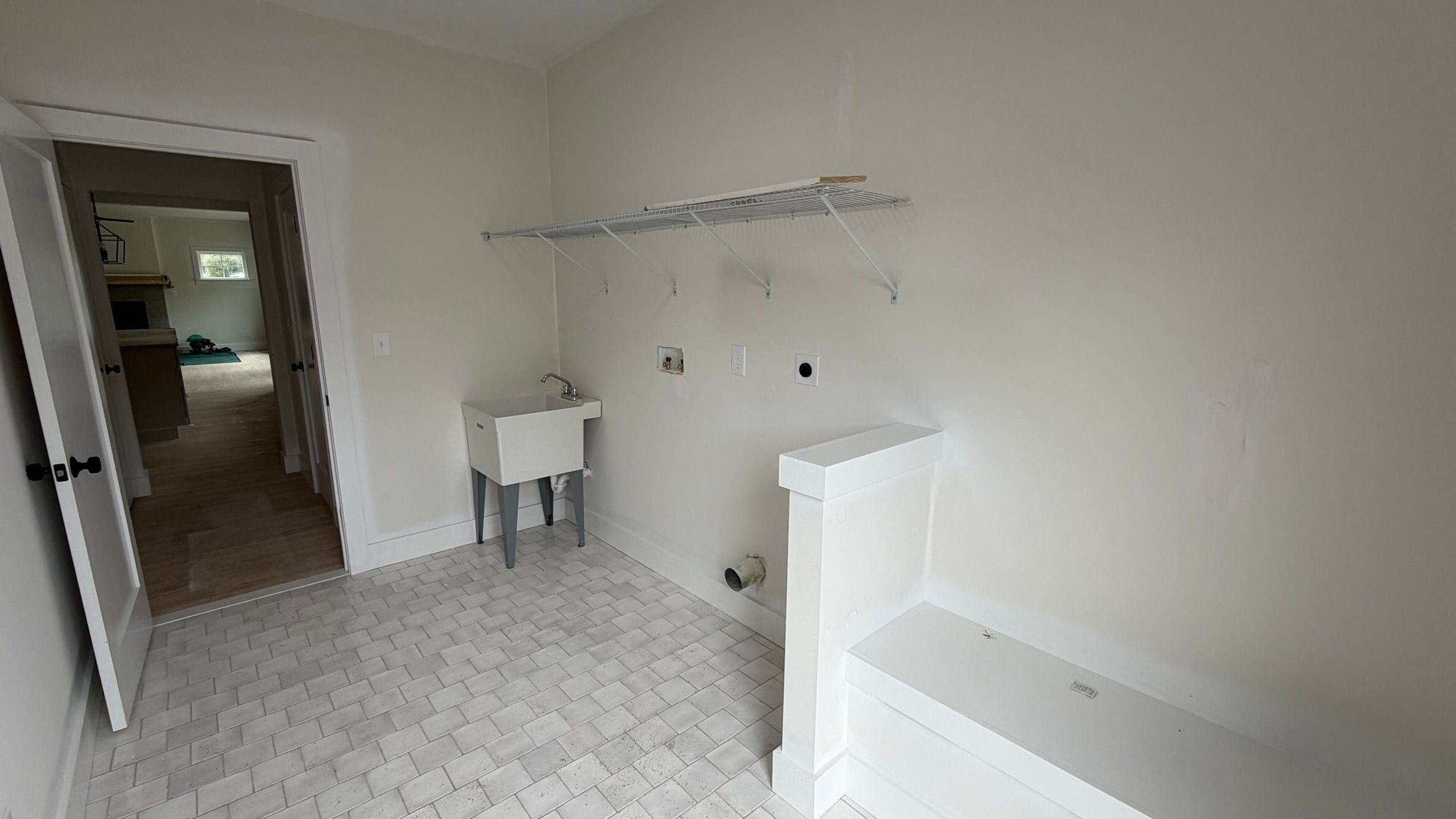 Construction Progress Photo of Fennel Laundry Area & Side Entrance with Built in Bench