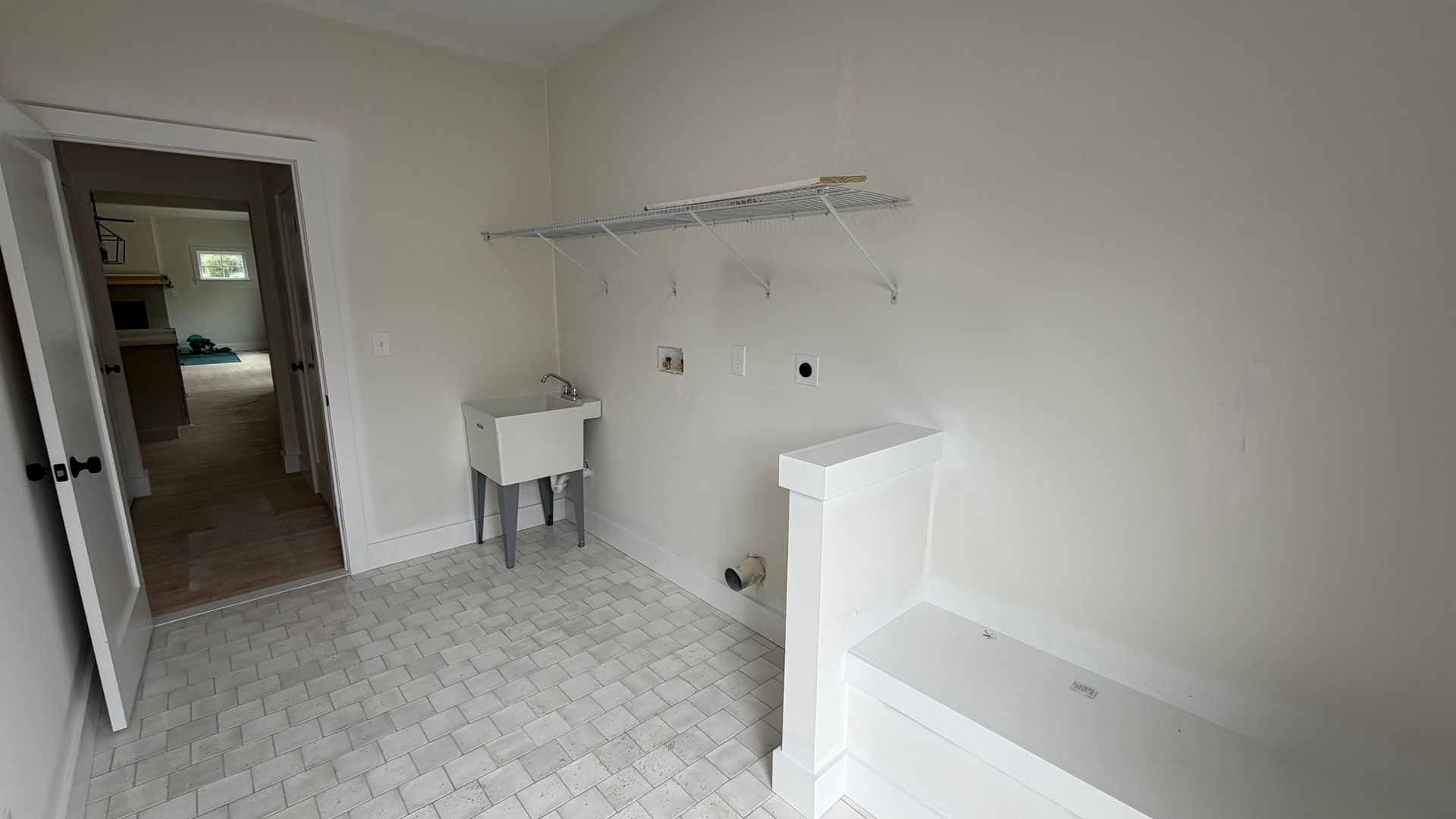 Construction Progress Photo of Fennel Laundry Area & Side Entrance with Built in Bench