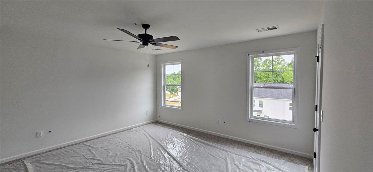 This bright bedroom features ample natural light a