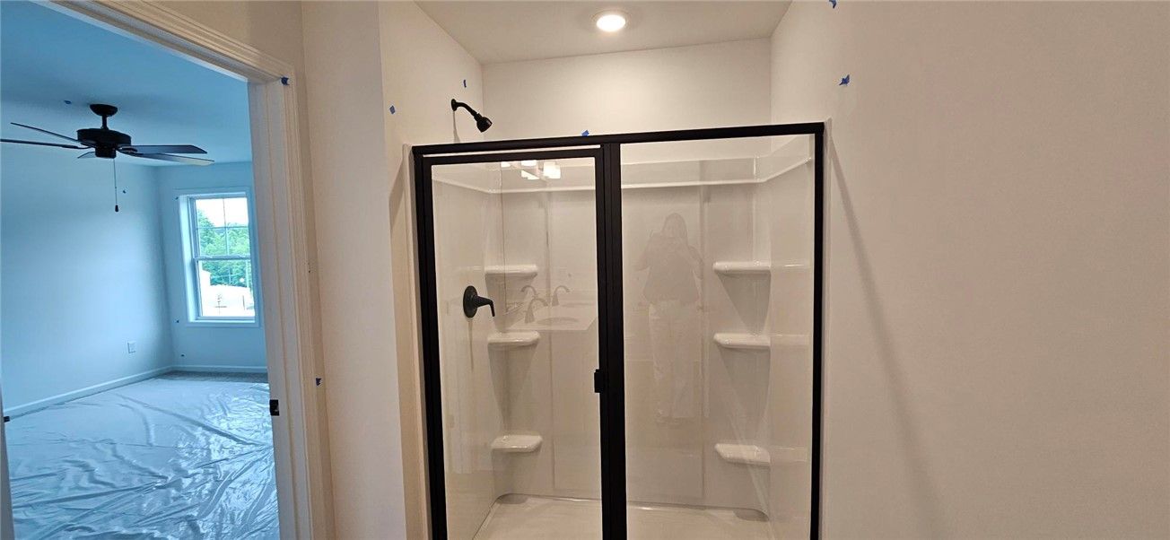 This newly constructed bathroom features a sleek,